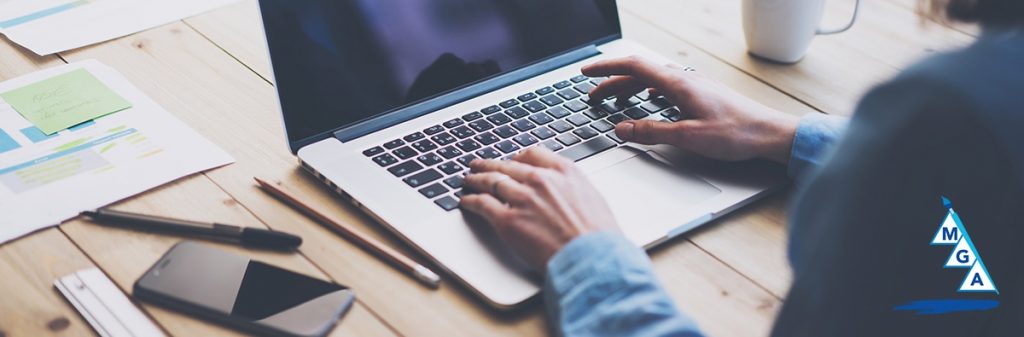 Office worker typing on a laptop